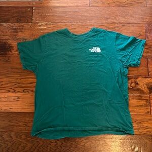 Green North face shirt